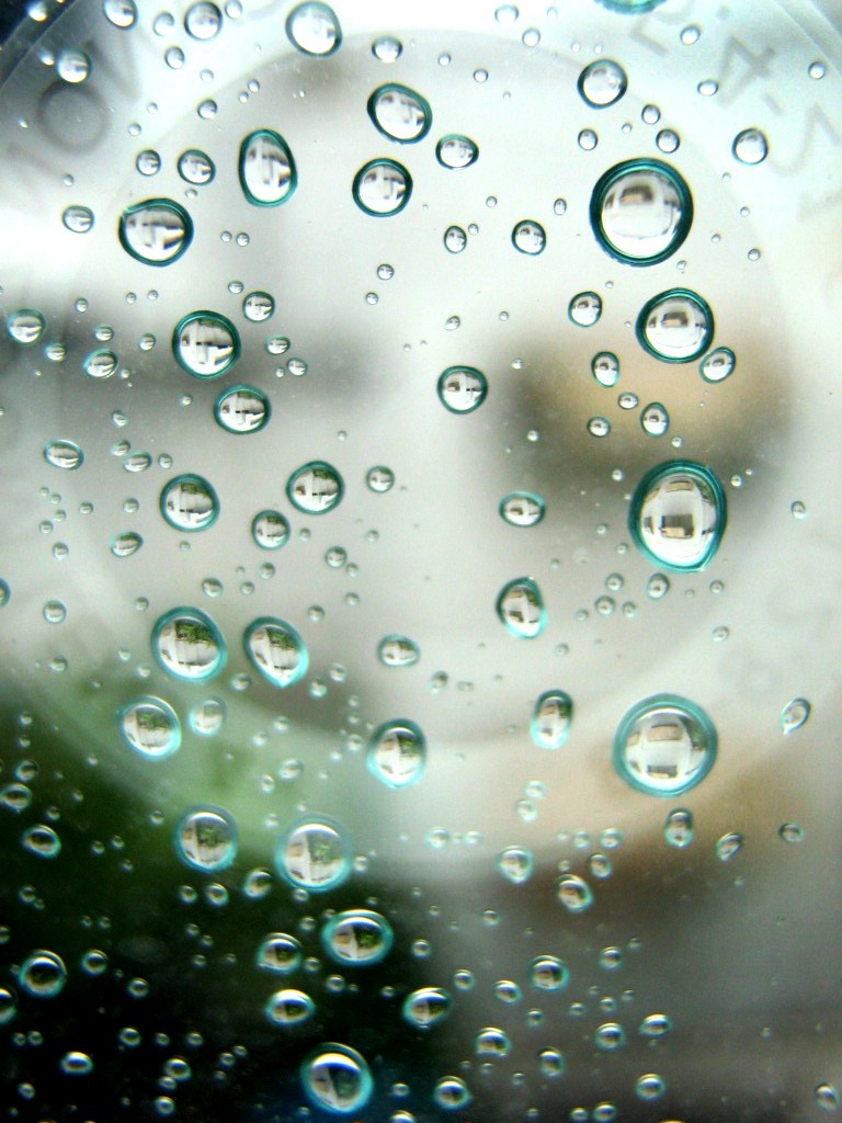 We can recognize drops of water on a window because we have a lens that shows us what they are. Photo by kappachan.